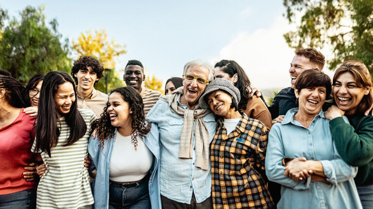 Happy multigenerational people having fun together in a public park - Diversity concept